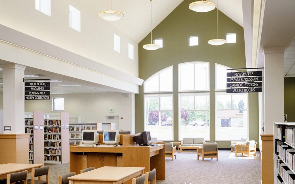 Bright interior of Lynden Public Library featuring large windows and modern furnishings.