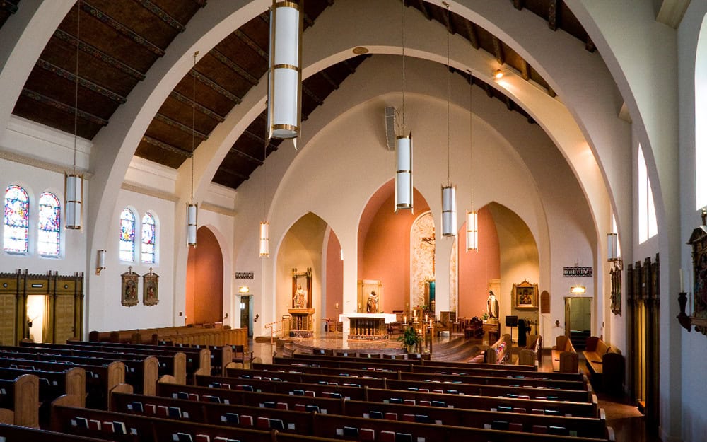 Interior view of St. John the Evangelist Parish, showcasing architectural design by RMC Architects.