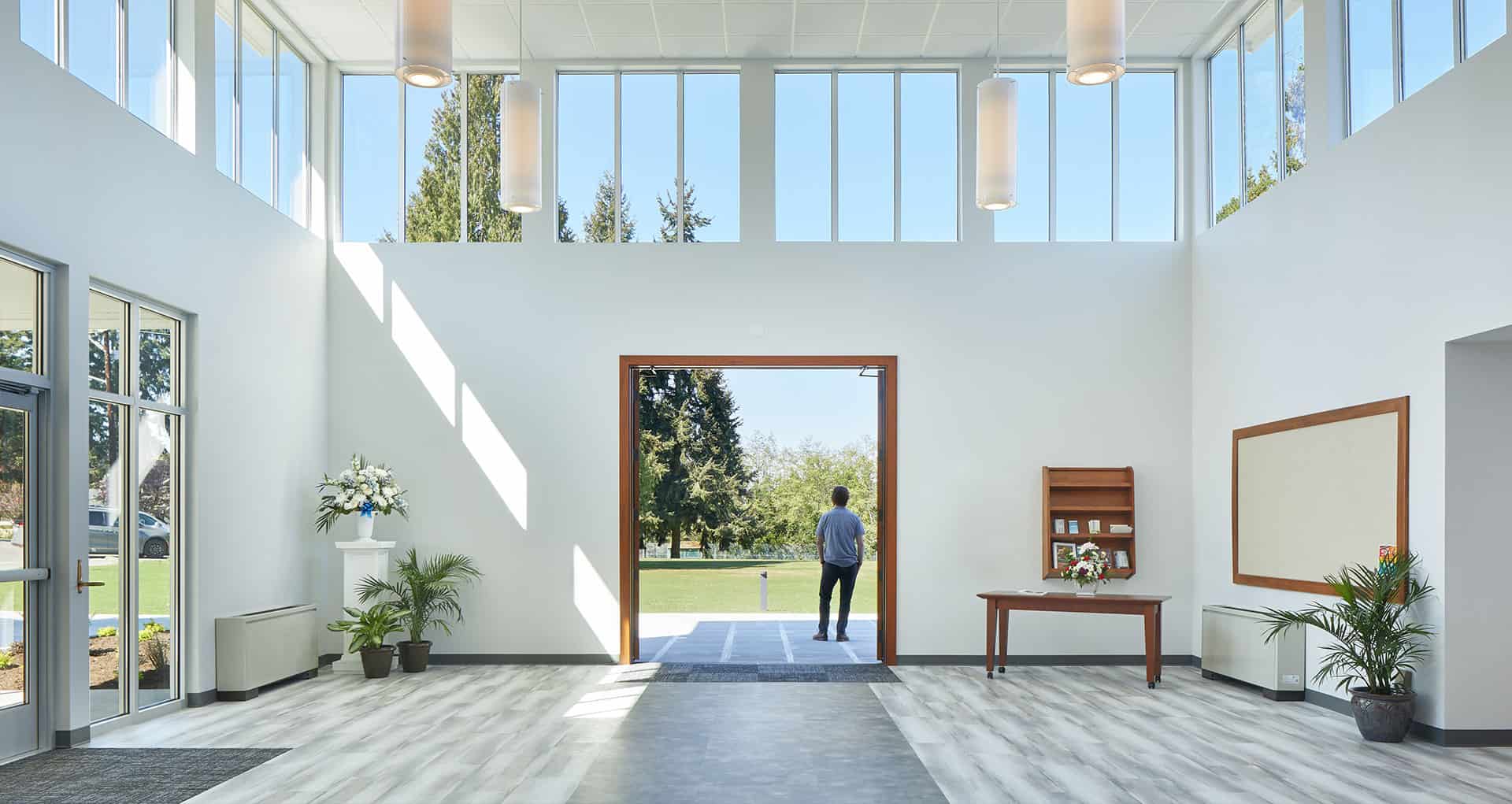 Interior space with expansive windows and sleek design, showcasing RMC Architects' contemporary arch.