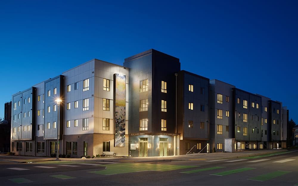 Modern Millworks Phase 1 building by RMC Architects at dusk.