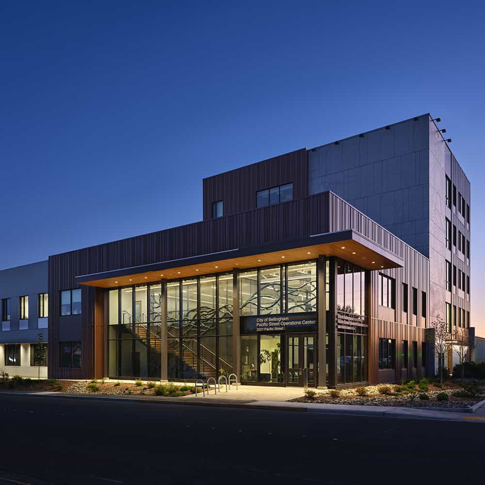 Modern city building with glass entrance and contemporary design features.